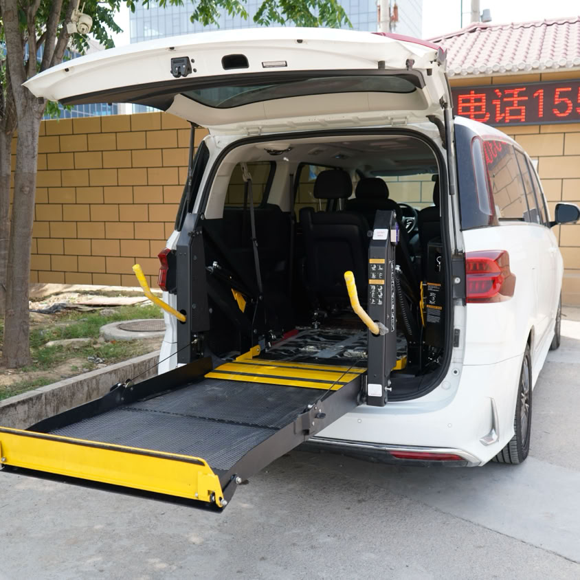 A minivan equipped with a wheelchair lift parked outdoors. Ideal for accessibility themes.