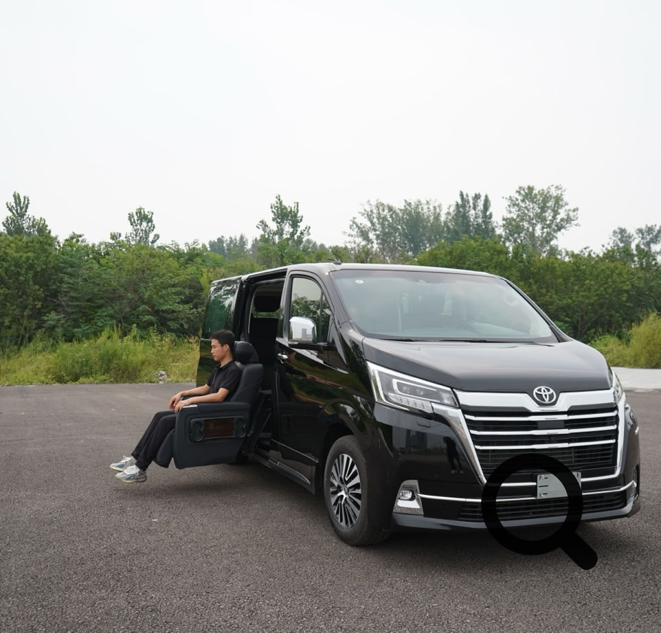 Toyota Granace van with a swivel seat offers enhanced accessibility in a serene outdoor setting.
